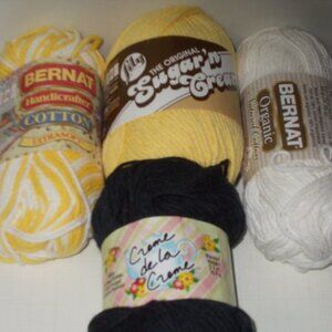 12 new balls of yarn with labels
